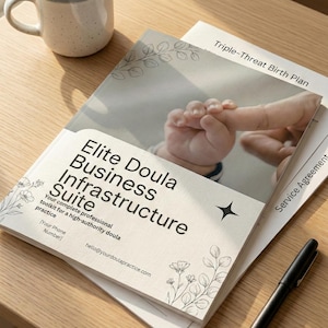 May include: A stack of printed materials, including a booklet titled "Elite Doula Business Infrastructure Suite" with a baby's hand in the image. A mug and pen are also on the wooden surface. The text includes "Triple-Threat Birth Plan" and "Service Agreement".