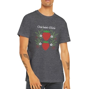 May include: A dark heather grey t-shirt with a white graphic of two strawberries and the text "Ode'imini-Giizis".