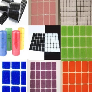 May include: Assortment of adhesive-backed hook and loop fasteners in various colours, including black, white, pink, green, blue, purple, and orange. The fasteners are arranged in rows and columns on a white background.