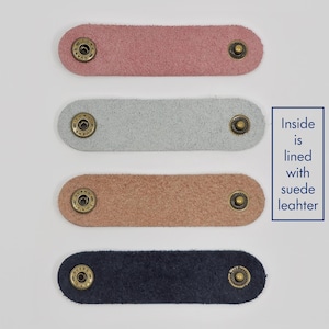 KALLACALLA suede-lined leather cord organizer straps for phone chargers and tech cables, available in multiple soft colors.