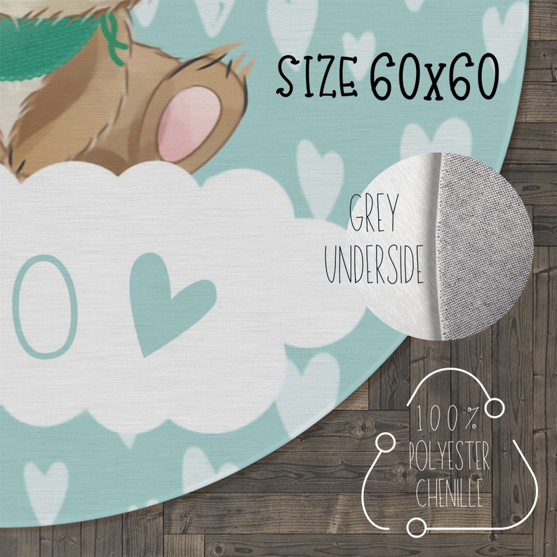 May include: A round, blue and white chenille rug with a cute bear design and hearts. The rug is 60 inches in diameter and has a grey underside. The text "SIZE 60x60" and "GREY UNDERSIDE" is printed on the rug. The text "100% POLYESTER CHENILLE" is printed on the rug's underside.