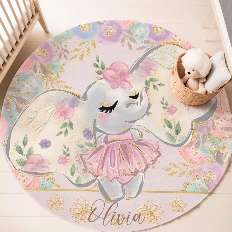 May include: A round pink and purple play rug with a watercolor floral design. A gray elephant with pink flowers in its hair is wearing a pink tutu. The rug has the name "Olivia" written on it.