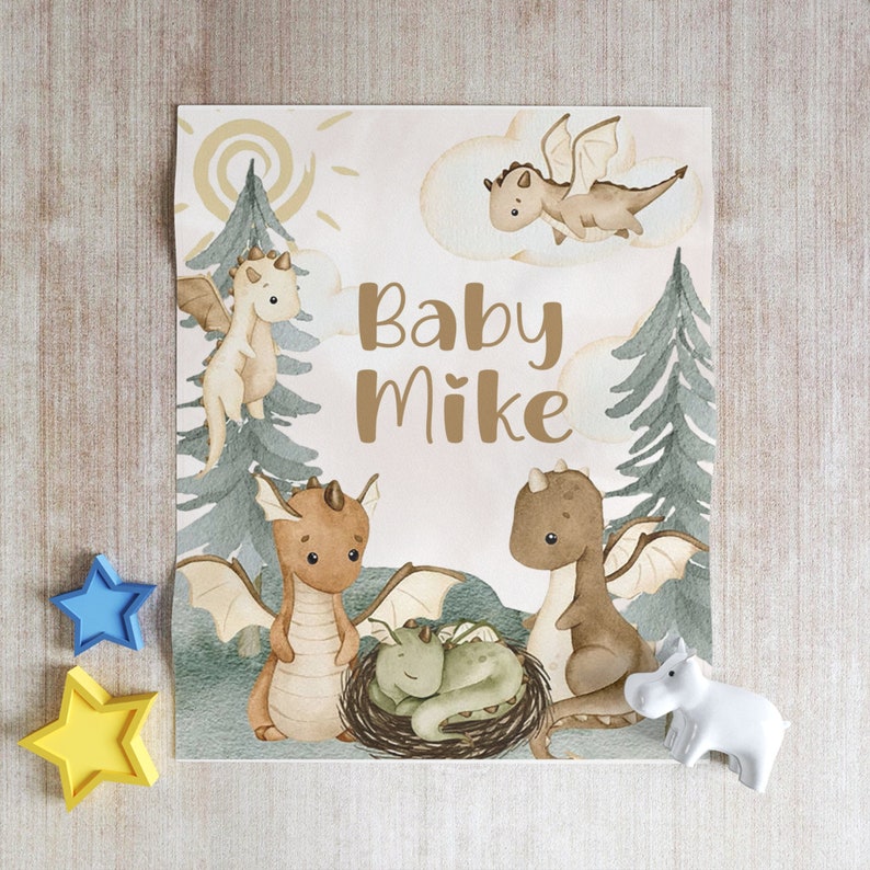 May include: A baby shower card featuring a watercolour illustration of brown dragons and the text "Baby Mike".