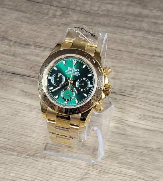 Rolex submariner green bezel and dial. Double cuffs white gold