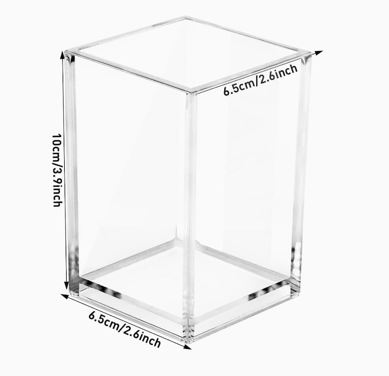 May include: Clear acrylic organizer with measurements in inches. The organizer is 6.5 inches wide, 6.5 inches deep, and 3.9 inches tall.