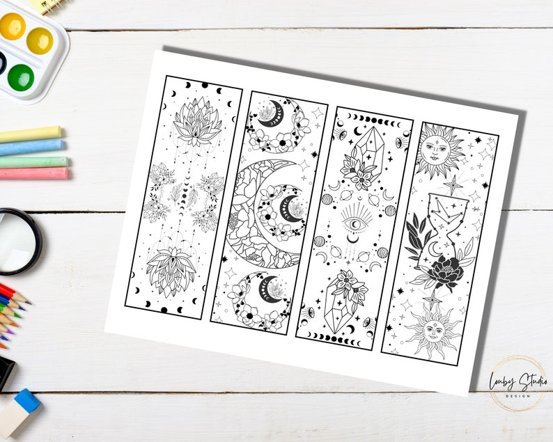 May include: Four printable bookmark designs featuring celestial and floral motifs. Each bookmark is outlined in black and ready to be colored. The designs include a lotus flower, a crescent moon, a crystal, and a sun.