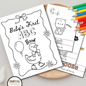 Puede incluir: Libro imprimible en blanco y negro "Baby's First ABC Book" con ilustraciones de un pato, un globo y un gato. El libro incluye el texto "Baby's First ABC Book" y "C is for Cat". Un juego de lápices de colores es visible en el fondo.