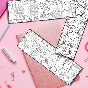 Puede incluir: Cuatro marcap&aacute;ginas imprimibles en blanco y negro con una jirafa, una tortuga, un cactus y un elefante. Los marcap&aacute;ginas est&aacute;n dise&ntilde;ados para colorear.