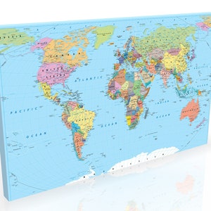 May include: A colourful world map printed on a light blue canvas. The map shows continents, countries, and oceans in various colours. The Pacific, Atlantic, and Indian Oceans are labelled. The canvas is rectangular and has a light blue border.