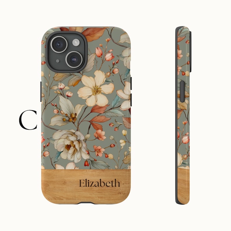 Puede incluir: Una funda de tel&eacute;fono verde con un patr&oacute;n floral y una parte inferior de aspecto de madera. La funda tiene el nombre "Elizabeth" impreso en la madera.