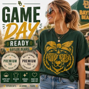 May include: Dark green t-shirt with a gold graphic of a bear wearing sunglasses and the words "Baylor Bear". The shirt also has the words "Game Day Ready" and "Baylor Bears" in gold. The shirt is made of soft cotton.