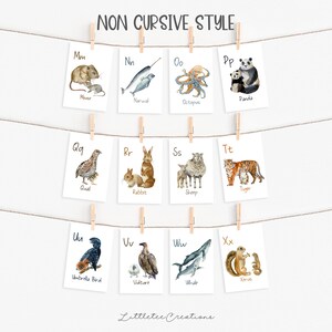 May include: A set of 12 alphabet flashcards featuring watercolor illustrations of animals. Each card has a letter and a corresponding animal name. The letters are in a non-cursive font. The animals include a mouse, narwhal, octopus, panda, quail, rabbit, sheep, tiger, umbrella bird, vulture, whale, and xerus.
