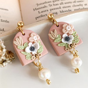 bouquet flower earrings in pink clay with white flowers and pearl drop