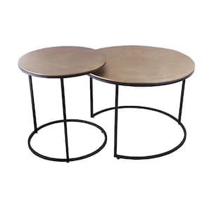 May include: Two round accent tables with gold-coloured tabletops and black legs. The tables are different sizes, with one slightly smaller than the other. The legs are thin and straight, with a circular base. The tables are suitable for a living room.