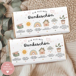 Puede incluir: Dos envoltorios de barras de chocolate con el texto "Ein Kleines Dankeschön" y varias ilustraciones. Los envoltorios presentan un sol, un arcoíris, una casa, una nube y una planta en maceta, con texto en alemán debajo.