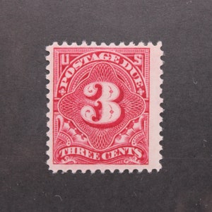 May include: A red United States postage stamp with the text "U.S. Postage Due" and "Three Cents" and the number "3" in the center.