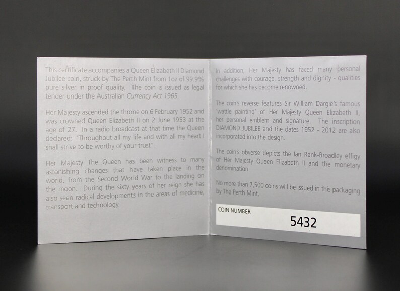May include: A white ceramic mug with a black handle and the text "But First, Coffee" in a black, bold font. The mug is on a white surface.