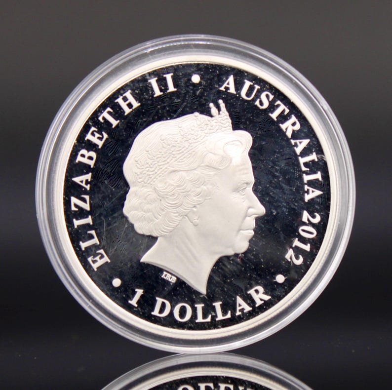 May include: A set of three ceramic mugs with a speckled, matte finish. The mugs are in shades of cream, light gray, and dark gray. Each mug has a simple, minimalist design, perfect for coffee or tea.