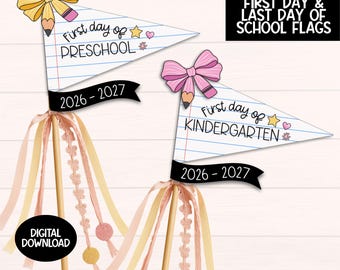 May include: Two triangular pennant flags on wooden sticks with ribbons. One flag features a yellow bow and pencil, reading First day of PRESCHOOL 2026-2027. The other has a pink bow and pencil, reading First day of KINDERGARTEN 2026-2027.