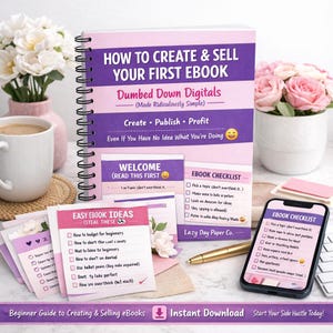 May include: A spiral-bound notebook titled "HOW TO CREATE & SELL YOUR FIRST EBOOK" with the text "Dumbed Down Digitals." Accompanying materials include checklists, notecards, a pen, and a smartphone displaying an ebook checklist. The theme is beginner guides.