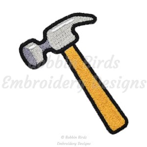 May include: A cartoon-style embroidery design of a yellow hammer with a black outline. The hammer is a common tool used for construction and DIY projects.