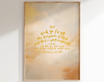 May include: A beige and brown watercolor painting with a gold quote from the Bible: "But seek ye first the kingdom of God and His righteousness; and all these things shall be added unto you. Matthew 6:33". The quote is framed in a light wood frame. The text "THE WORD SOWN DEEP" is below the frame.
