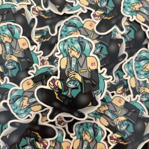 May include: A collection of stickers featuring a cartoon anime character with blue hair and a green outfit holding a glass bong. The stickers have the number "01" printed on them.