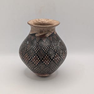 May include: A set of three ceramic mugs with a speckled, matte finish. Each mug features a different color: light blue, cream, and gray. The mugs have a simple, modern design and a comfortable handle. Perfect for coffee or tea.