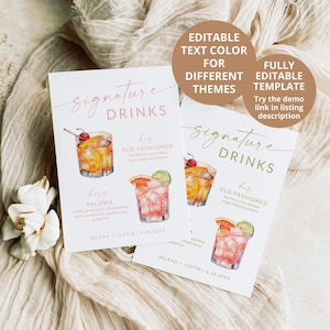 May include: Two printable wedding drink sign templates with watercolor illustrations of cocktails. The signs are titled "Signature Drinks" and list "His Old Fashioned" and "Hers Paloma" with the ingredients for each drink. The signs are white with pink and green text.
