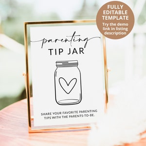 May include: A printable sign in a gold frame that says "parenting tip jar" with a drawing of a mason jar with a heart inside. The sign is on a wooden table.