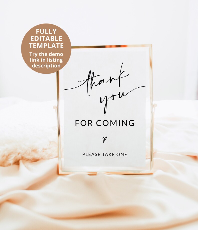 May include: A gold-framed sign with the text "thank you for coming" and a heart symbol. The sign also says "Please take one".