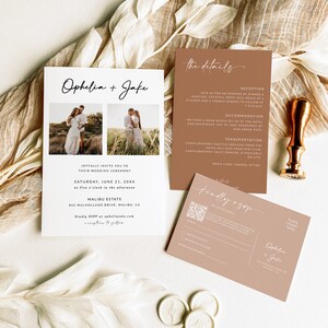 May include: A wedding invitation suite with a brown and white color scheme. The invitation features a photo of the couple and the text "Ophelia + Jake". The details card includes information about the reception, accommodation, and transportation. The RSVP card has a QR code and the text "Kindly RSVP".