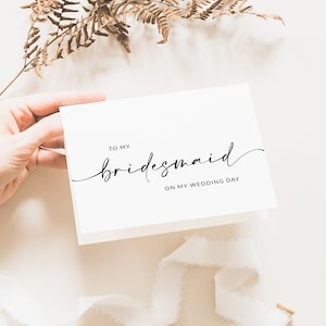 This is a minimalist bridesmaid thank you bifold card written in cursive and sans font. It is blank on the inside so you can write a special note for your bridesmaids!