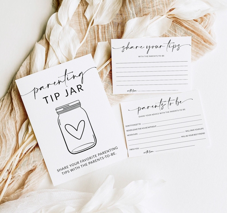 May include: Two printable cards for a baby shower or new parent gift. The first card has a black and white illustration of a mason jar with a heart inside and the text 'parenting tip jar' and 'share your favorite parenting tips with the parents-to-be.' The second card has the text 'share your tips with the parents-to-be' and 'parents to be share your advice with the parents-to-be' with blank lines for writing tips.