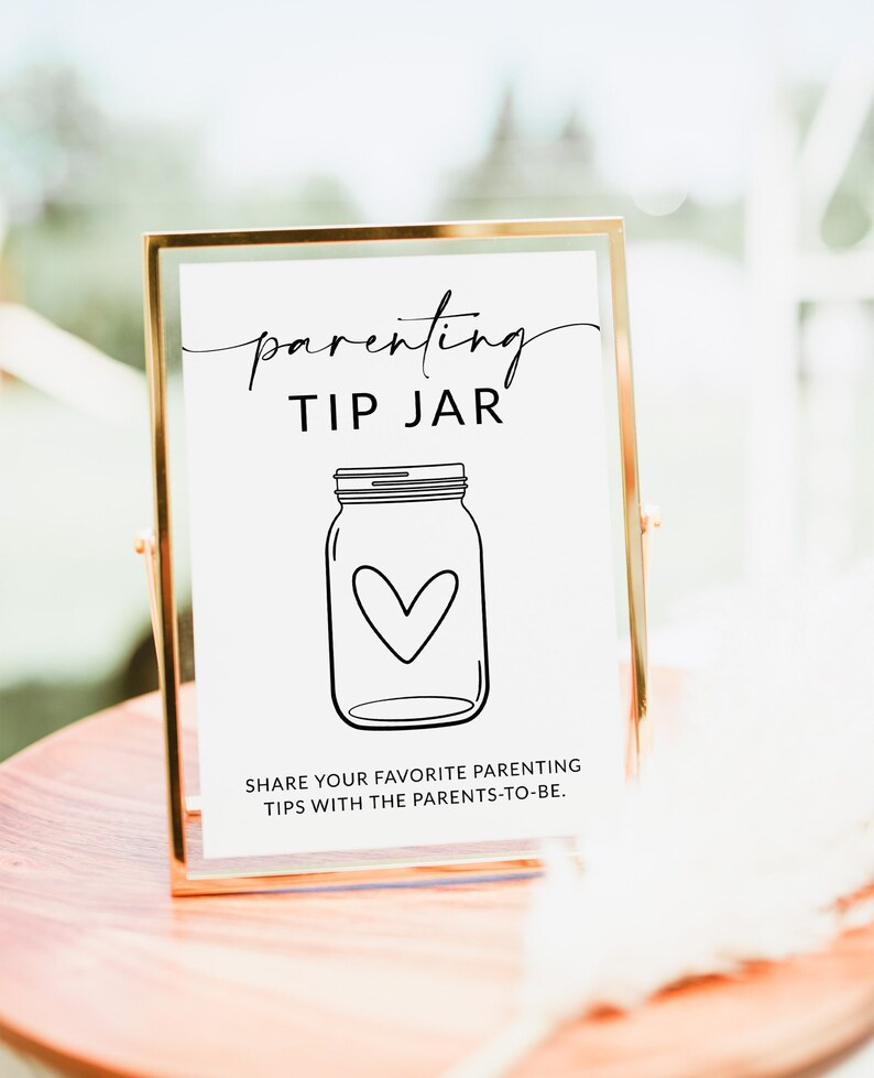 K&ouml;nnte beinhalten: Ein goldfarbener Rahmen mit dem Text "parenting tip jar" und einer Zeichnung eines Einmachglases mit einem Herzen darin. Der Text unter dem Glas lautet "Teilen Sie Ihre Lieblings-Elterntipps mit den werdenden Eltern."