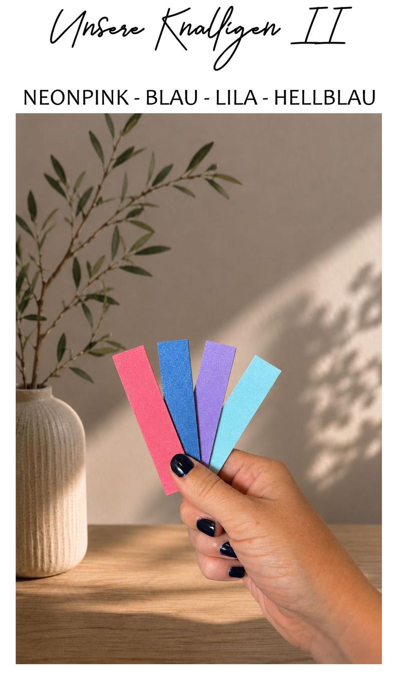 May include: Four rectangular strips in neon pink, blue, purple, and light blue. The text at the top reads "Unsere Knalligen II" followed by "NEONPINK - BLAU - LILA - HELLBLAU". The strips have a textured finish and are held in a fan shape.