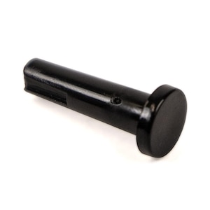 May include: A black plastic pin with a rounded head and a slot on the side.