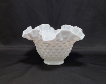 May include: White milk glass bowl with a ruffled rim and a textured, dotted surface.