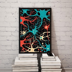 May include: A framed art print featuring a colorful abstract design of neuron-like structures in teal, red, and cream against a black background. The artwork is displayed on a stack of white books against a white brick wall.