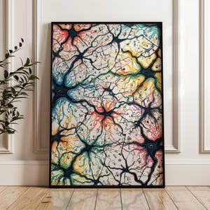May include: A framed art print with a vibrant abstract design, reminiscent of neural networks. The artwork displays a complex pattern of interconnected lines and shapes in various colours, including blue, red, yellow, and green. The print is encased in a black frame and displayed against a white wall.