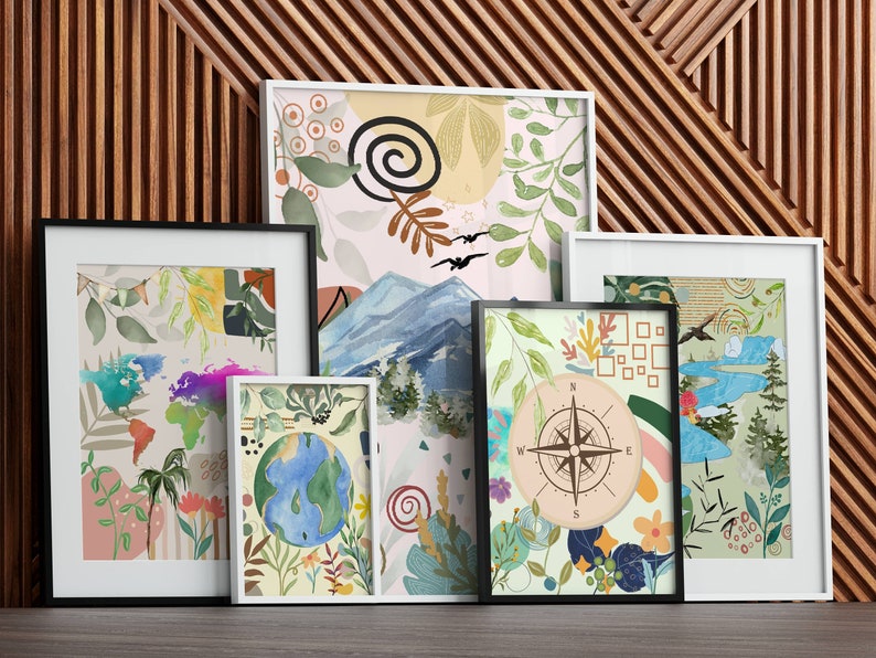 May include: Five framed art prints with a nature theme. The prints feature a compass, a globe, mountains, and various floral and leaf designs. The prints are in white and black frames and are arranged on a wooden surface.