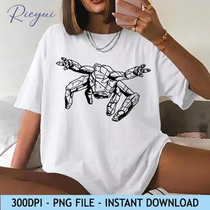 May include: White t-shirt featuring a black geometric design of a figure with outstretched arms. The shirt has short sleeves and a relaxed fit. Text at the bottom reads "300DPI - PNG FILE - INSTANT DOWNLOAD".