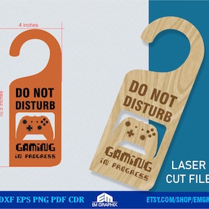 May include: Door hanger in orange and wood-grain, with the text "DO NOT DISTURB GAMING IN PROGRESS." The orange hanger is 26.67 cm tall and 10.16 cm wide. The wood-grain hanger has a laser-cut controller design.