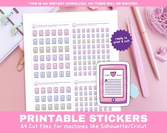 May include: Printable stickers with a tablet design, a heart, and text. The stickers are on a white sheet, set against a pink backdrop. The text "PRINTABLE STICKERS" and "A4 Cut Files" are also visible.