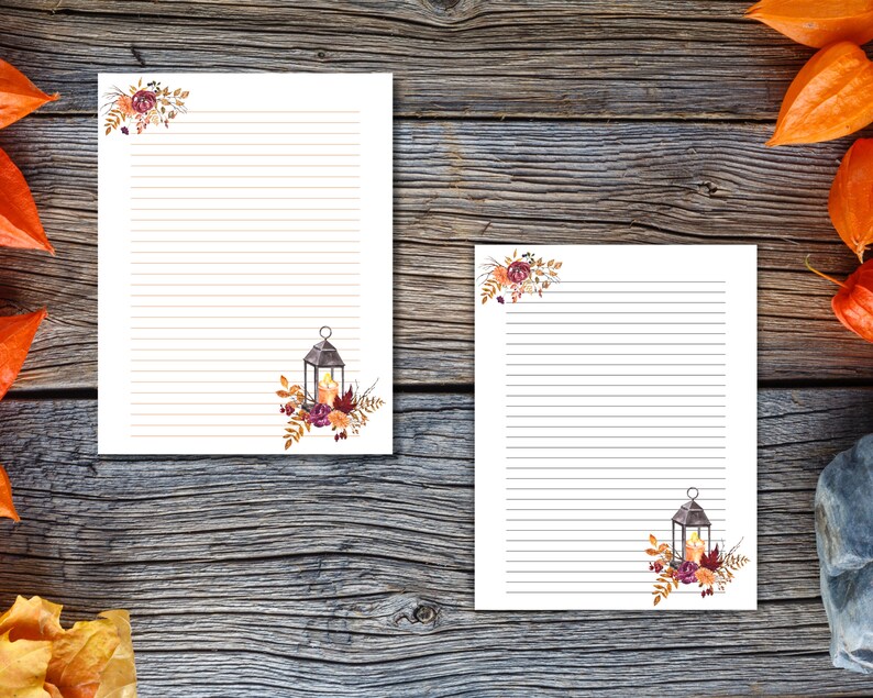 Fall stationery with lined pages featuring lantern and floral designs in warm autumn colors. Perfect for journaling, notes, or letters.