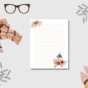 Fall lined stationery with lantern and floral design, autumn themed writing paper for Thanksgiving notes and cozy seasonal letters.