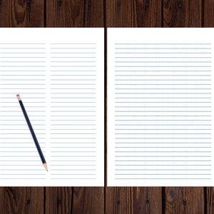 Two lined paper pages displayed side by side on a dark wood surface, with a black pencil resting diagonally across the left page.