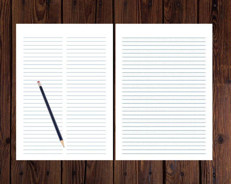 Two lined paper pages displayed side by side on a dark wood surface, with a black pencil resting diagonally across the left page.