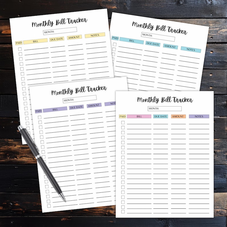 Four monthly bill tracker sheets displayed on a dark wooden desk with a pen, each page showing lined rows and colorful column headers in different pastel styles.