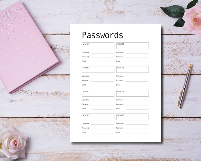 Open ring-bound planner displaying password pages labeled “Passwords” and “Password Tracker,” styled on a light surface with gold clips, decorative leaves, scattered confetti, and a pen.